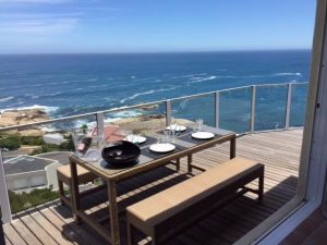 a four-bedroom luxury rental villa with ocean & mountain views in Cape Town.||Rent 13 Sunset Avenue