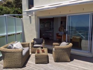 a four-bedroom luxury rental villa with ocean & mountain views in Cape Town.