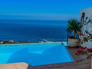 pool2||main_ensuite2||oceanscape_-_11_oudekraal_rd_camps_bay_2_of_85||second_bedroom4||kitchen3||second_lounge2||first_lounge4||first_lounge2||upstairs_balcony5||dining1||downstairs_balcony0
