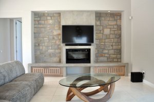 Lounge with fireplace -The Cliffhanger Villa - Plettenberg Holiday Villa