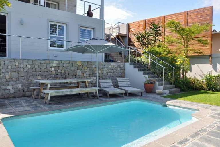 Vacation-Apartment-in-Plettenberg-Garden-Route-Swimming-pool-looking-at-the-staircase-to-the-sundowner-patio