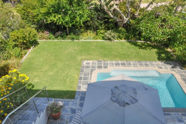 View of pool from downstairs patio - zenon vacation home - garden route