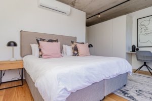 Modern and spacious bedroom on second level of apartment 40 on L