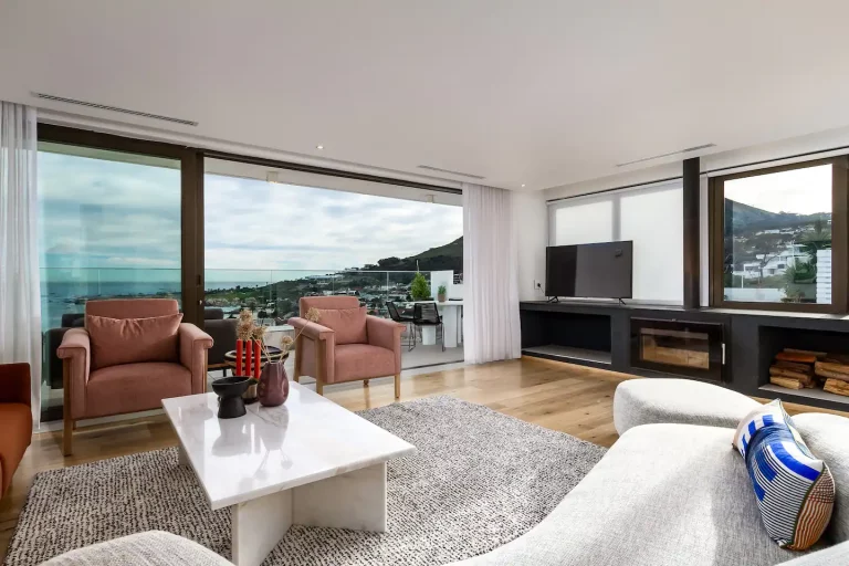 4. Living Room (B) with Sea and Mountain View- Bask in the sweeping ocean and mountain views from the living room, featuring a cozy fireplace