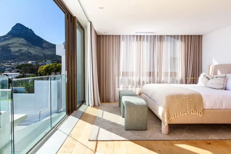 Master Bedroom (B) with Mountain View- Elegantly decorated sun drenched bedroom with spectacular views of the ocean featuring modern fittings