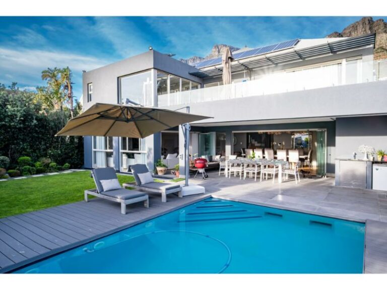 azzura-mountanious-backdrop-pool-umbrella-sunbeds