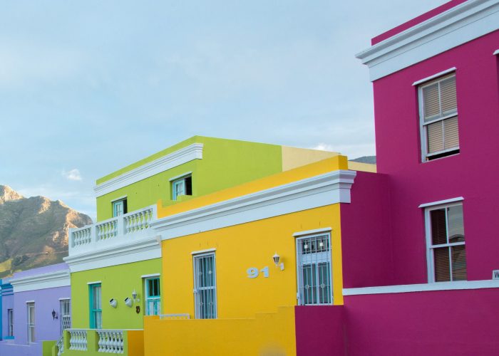 Colorful homes along one of the streets in Bo-Kaap's historic Cape Malay quarter in Cape Town in the Western Cape of South Africa along the hills at the base of Signal Hill||||||